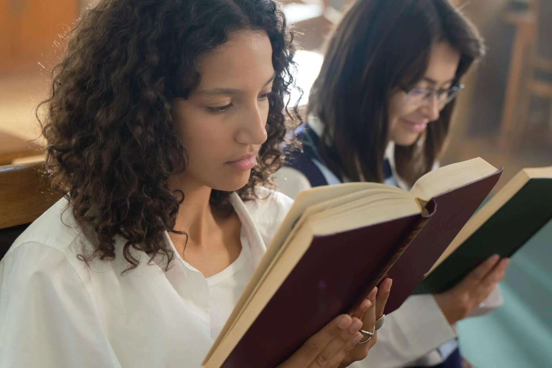 Two students reading books